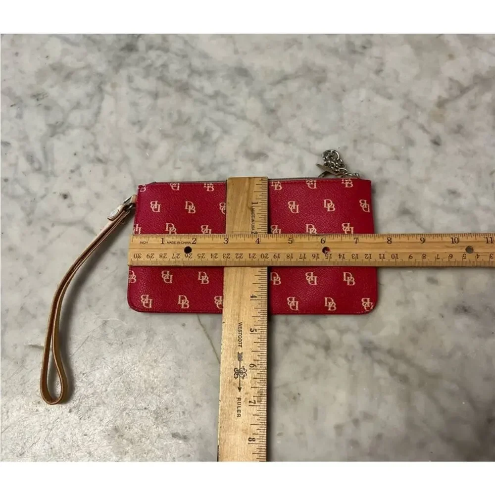 Dooney & Bourke monogrammed red coated canvas wristlet